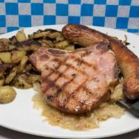 One Wurst & One Kassler Rippchen · Choose your wurst and served with German potato salad and sauerkraut(Image shows homefries a...