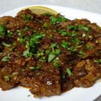Goat Sukha · GLUTEN FREE - Mutton Sukha is made with fresh meat, desiccated masalas, onions & tempered wi...