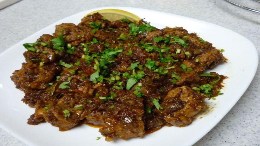Goat Sukha · GLUTEN FREE - Mutton Sukha is made with fresh meat, desiccated masalas, onions & tempered with curry leaves.