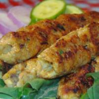 Chicken Seekh Kabab · Spiced flavorful chicken mince, shaped onto skewers & roasted until it gets golden in color.