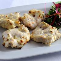 Chicken Malai Tikka · GLUTEN FREE - Boneless chicken marinated in mild herbs, ginger, garlic & sour cream cooked i...