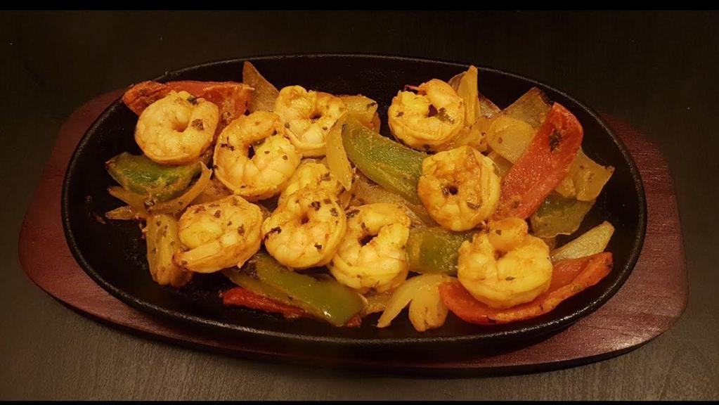 Tandoori Shrimp · GLUTEN FREE - Marinated shrimp, bell pepper, onions in authentic chef special spices, yogurt & herbs cooked in a cylindrical Indian clay oven.