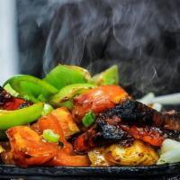 Pariwaar Special Vegetarian Combo Sizzler · GLUTEN FREE - Comes with few pieces of (cauliflower, cottage cheese, onions, bell pepper) mi...