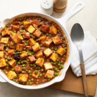 Mattar Paneer · GLUTEN FREE - Fire-roasted peas and cottage cheese mix in a tomato-based sauce with chef spe...