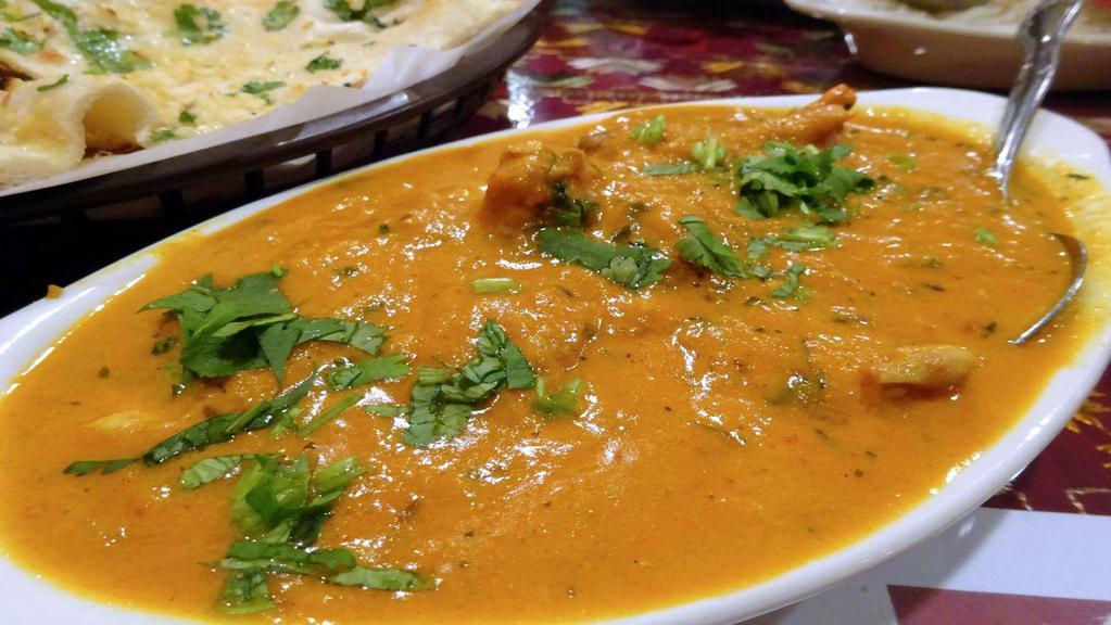 Goat Korma · GLUTEN FREE - Goat cooked with potatoes, chef spices, mixed with creamy nutty curry that is mildly spiced to keep authentic Hyderabadi flavors.