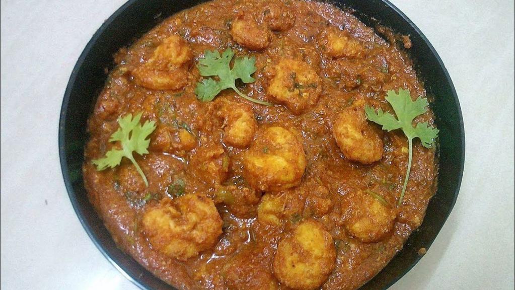 Royyala Kura (Shrimp) · GLUTEN FREE - Shrimp curry cooked in Andhra style (south India) with sauteed onion, tomatoes, and other chefs special Indian spices