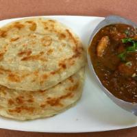 Kerala Paratha With Chicken Curry · A layered flaky flatbread 2pc, serves with chef special chicken curry.