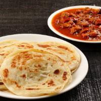 Kerala Paratha With Goat Curry · A layered flaky flatbread 2pc, serves with chef special goat curry.