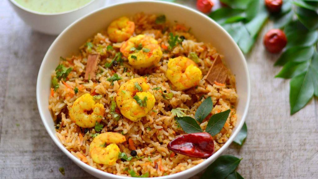 Shrimp Biryani · GLUTEN FREE - One of the best flavorful Biryani made with our authentic Hyderabadi flavors with long grain basmati rice, exotic spices exported from Hyderabad India, cooked with roasted shrimp.
