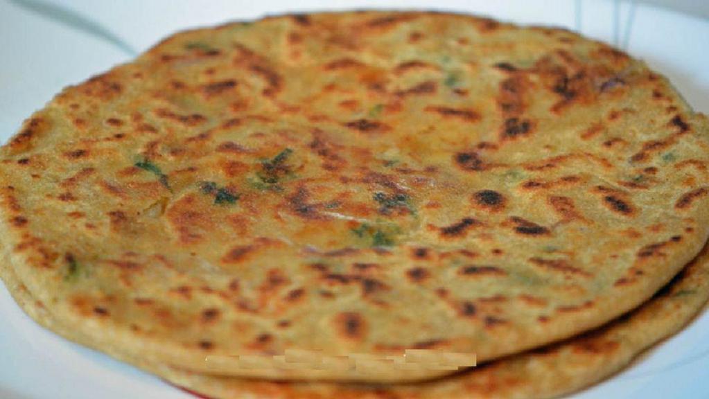 Aloo Paratha · Made with whole wheat flour mix with water, salt stuffed with potatoes cooked on griddle.