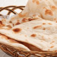 Plain Naan · Made with white flour mix with milk, yeast & salt cooked in charcoal (Clay) oven.