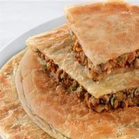 Keema Paratha · Made with whole wheat flour mix with milk, salt stuffed with ground meat cooked on griddle.