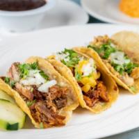 Taco · served with onions and cilantro