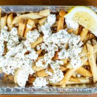Yiasou Fries · Topped with melted Feta cheese, lemon and oregano.