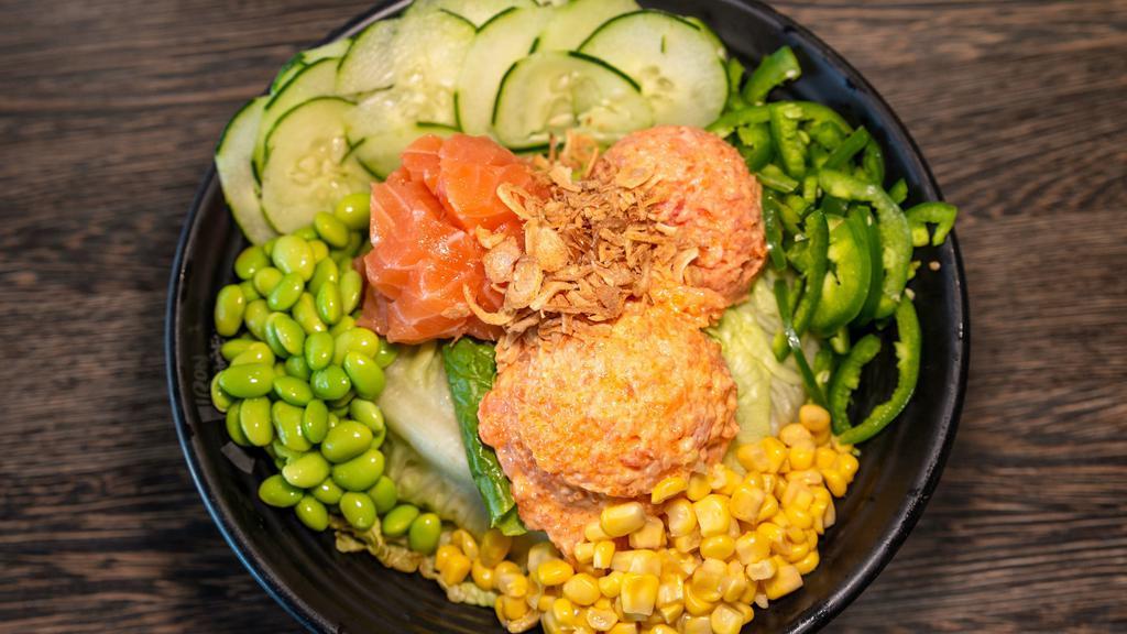 Fire Bowl · Spicy tuna, spicy salmon, salmon, cucumber, jalapeño, edamame, spicy mayo, honey wasabi sauce, sweet corn, and crispy onions. Consuming raw or under cooked meats, fish or shellfish may increase your risk of food-borne illness, especially if you have certain medical condition.