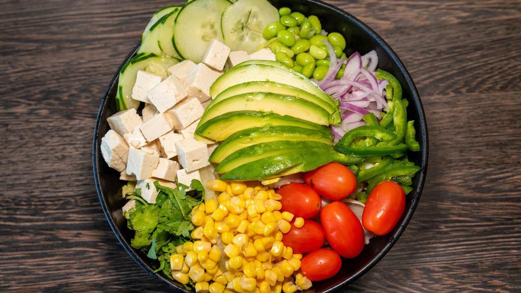 Green Bowl · Organic tofu, scallions, cilantro, cucumber, edamame, red onions, jalapeño, avocado, yuzu dressing, grape tomatoes, and sweet corn.