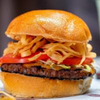 Chipotle Bison Burger · Natural raised buffalo meat marinated in chipotle seasoning topped with crispy onion straws,...