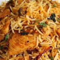 Chicken Biryani · Boneless Chicken, Basmati rice, cooked with exotic Indian herbs and served with raita.