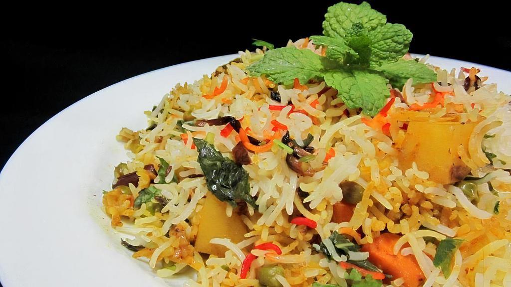 Vegetable Dum Biryani · Basmati rice cooked with seasonal vegetables and Indian herbs.