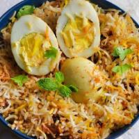 Egg Briyani · Basmati rice, cooked with Boiled Eggs with exotic Indian herbs and served. with raita.