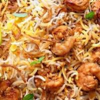 Shrimp Briyani · Shrimp cooked in basmati rice, over a low fire with Indian herbs.