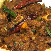 Mutton Sukka · Goat on the bone cooked in a traditional south Indian style.