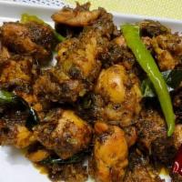 Chicken Pepper Fry · Boneless chicken marinated in crushed peppercorns fried with chopped onions and sauteed to p...