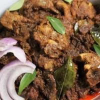 Lamb Sukka · Boneless lamb cooked in a traditional south Indian style.