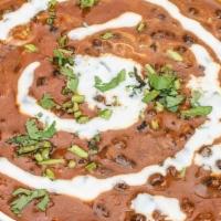 Dal Makhani · Black lentils & kidney beans Simmered Overnight, Enriched With Butter And Cream.