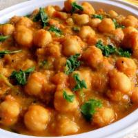 Channa Masala · Chickpeas cooked in onion tomato masala gravy along with authentic Indian spices.