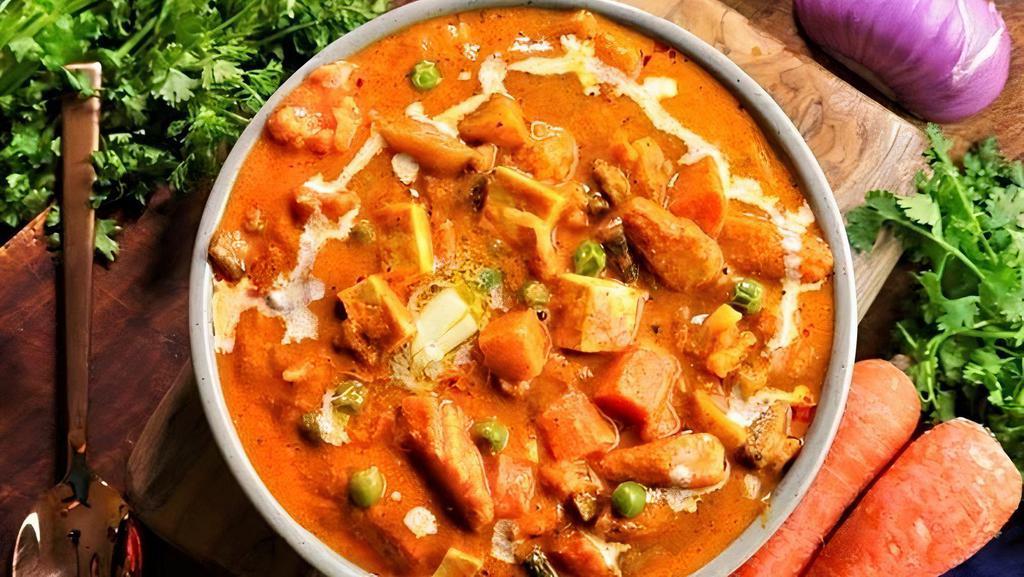 Vegetable Tikka Masala · Assorted vegetables cooked in a rich creamy tomato-based gravy.