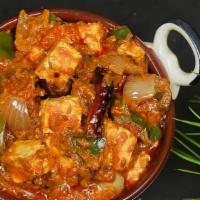 Kadai Paneer · Cottage cheese tossed with fresh Indian herbs and spices in onion and tomato-based gravy.