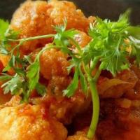 Aloo Gobi Masala · Cauliflower and potatoes cooked in onion and tomato-based gravy with fresh Indian spices.