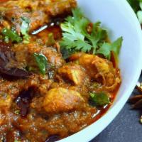 Chicken Chettinad · Spicy Chettinad style preparation with boneless chicken, onions & traditional spices.