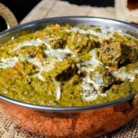 Lamb Saag · Tender boneless lamb pieces cooked in spicy, creamy spinach-based gravy.