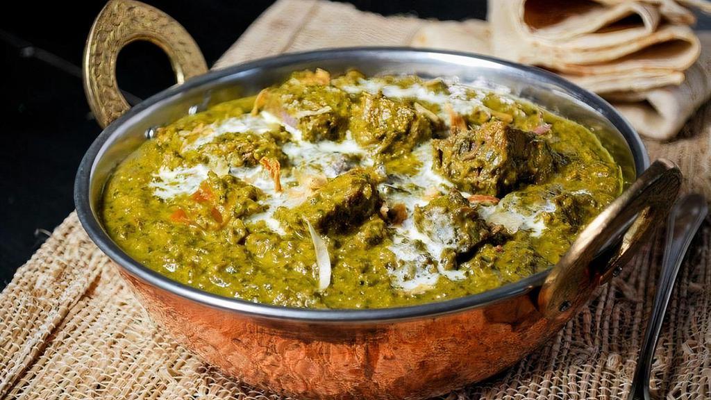 Lamb Saag · Tender boneless lamb pieces cooked in spicy, creamy spinach-based gravy.