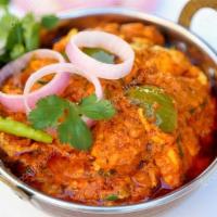 Kadai Chicken · Boneless chicken with bell pepper, onion tossed with fresh herbs and spices cooked in Kadai.