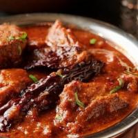 Vindalo Lamb · A traditional Goanese specialty of Lamb. cooked in flavors of mustard with turmeric, ginger,...