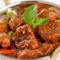 Kadai Lamb · Tender pieces of Lamb(boneless), bell pepper, onion tossed with fresh herbs and spices cooke...