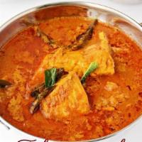 Malabar Fish Curry · Tilapia boneless fish cooked in gravy with coconut milk fresh herbs and spices.