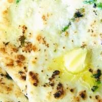 Butter Naan · Traditional Indian bread with butter baked in clay oven.