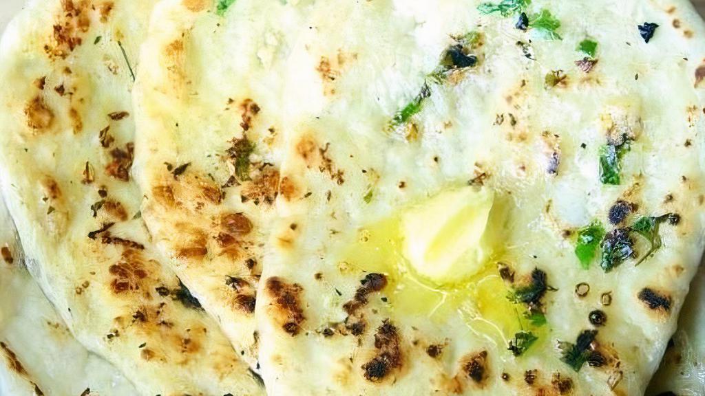 Butter Naan · Traditional Indian bread with butter baked in clay oven.