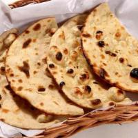 Roti · Traditional Indian wheat bread baked in clay oven with no butter.