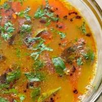 Rasam · Tamarind based soup with tomato, chillies, pepper and other seasonings.
