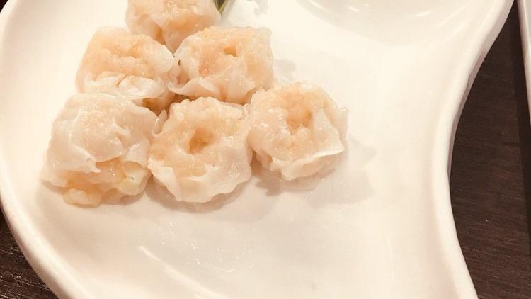 Shumai Soup · Three pieces of shumai in clear soup.