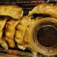 6 Piece Gyoza · Pan-fried pork dumplings.