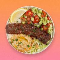 Beef Kebab Rice Bowl · Ground beef over basmati rice with hummus, diced cucumber and tomato salad, shredded green c...