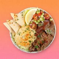 Beef And Lamb Gyro Hummus Bowl · Marinated beef and lamb over hummus, diced cucumber and tomato salad, shredded green cabbage...