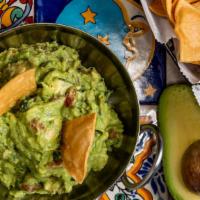 Guacamole & Chips · Fresh guacamole with homemade crunchy chips