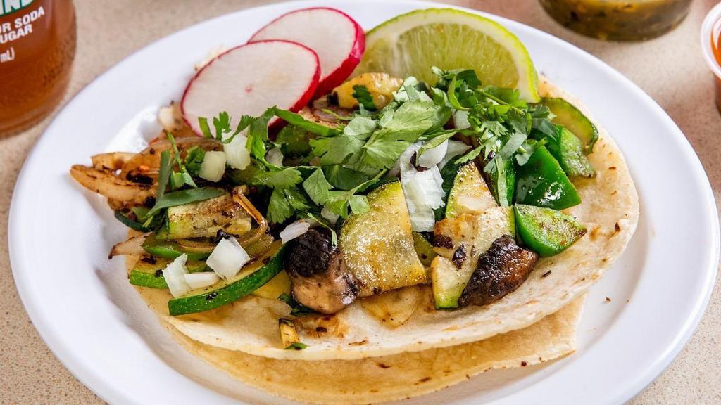 Mushroom Taco (Order Of 3) · Topped with cilantro, onions, lime wedge, radish. Choice of green, red or guacamole sauce.